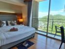 Spacious bedroom with a view of the mountains and natural light