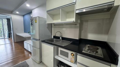 Modern kitchen with stainless steel appliances and granite countertops