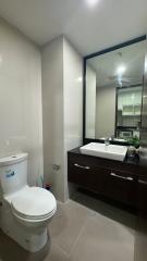 Modern bathroom with a large mirror and vanity