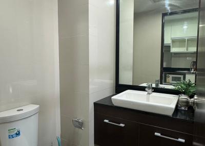 Modern bathroom with a large mirror and vanity