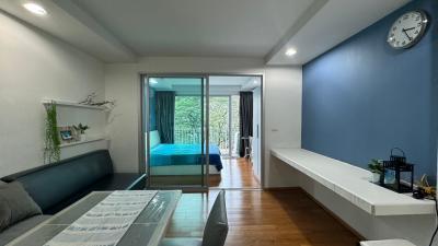 Bright and modern bedroom with double bed and balcony access