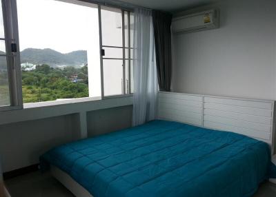 Cozy bedroom with mountain view and ample natural light