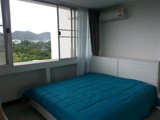 Cozy bedroom with mountain view and ample natural light