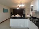 Modern kitchen with stainless steel appliances and a central island