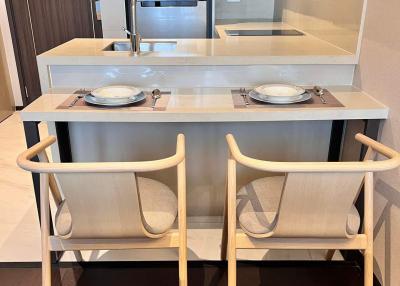 Modern kitchen with a breakfast bar and two chairs