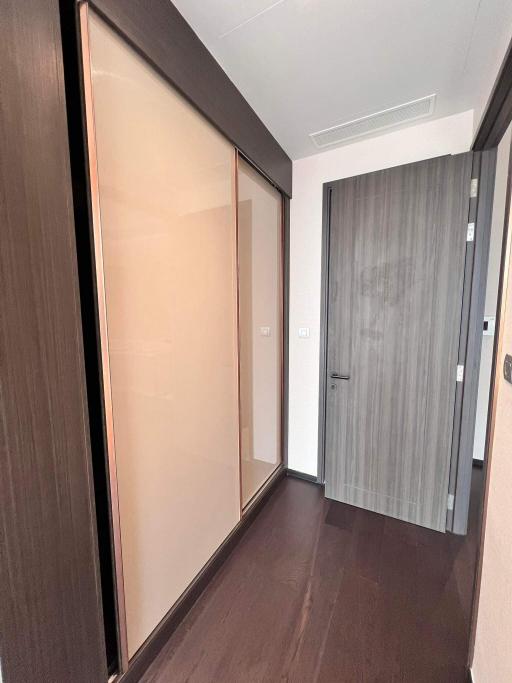 Modern hallway interior with wooden floors and sliding door