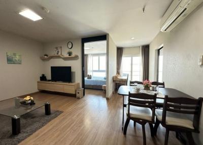 Spacious and well-lit living room with dining area and modern amenities