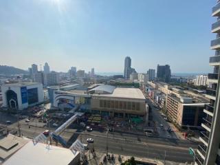 Panoramic city view from a high-rise apartment balcony