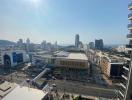 Panoramic city view from a high-rise apartment balcony