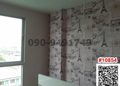 Bedroom with modern wallpaper and city view