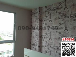 Bedroom with modern wallpaper and city view