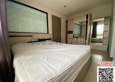 Spacious bedroom with large bed and modern amenities