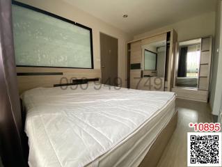 Spacious bedroom with large bed and modern amenities