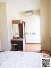 Cozy bedroom with wooden furniture and air conditioning