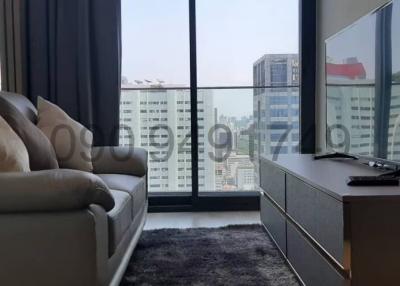 Modern living room with cityscape view through large windows