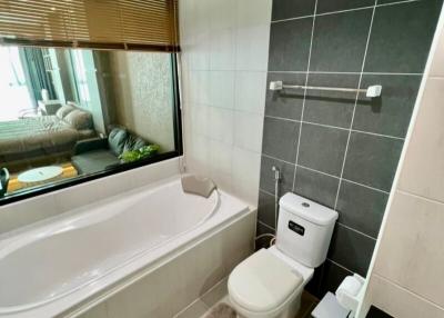 Modern bathroom interior with a bathtub and toilet
