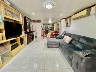 Spacious living room with tiled flooring and modern furniture