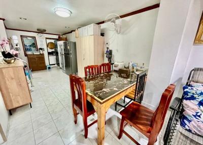 Spacious kitchen with dining area and tiled flooring