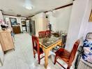 Spacious kitchen with dining area and tiled flooring