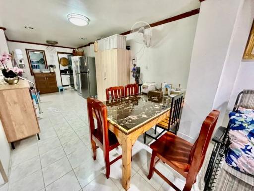 Spacious kitchen with dining area and tiled flooring