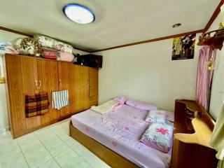 Cozy bedroom with wood furniture and ample storage