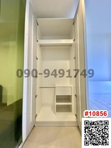 Compact built-in white wardrobe with shelves and storage spaces