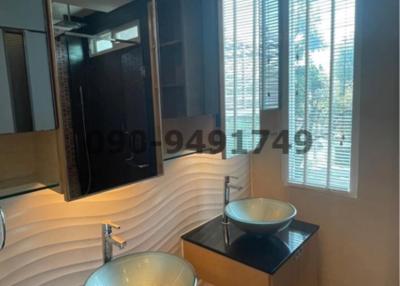 Contemporary bathroom with vessel sink and large mirror