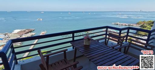 Spacious balcony with ocean view and outdoor seating