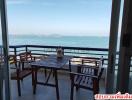 Sea view balcony with outdoor dining set