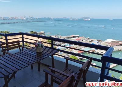 Seaside balcony view with outdoor furniture