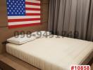 Cozy bedroom with American flag wall decor