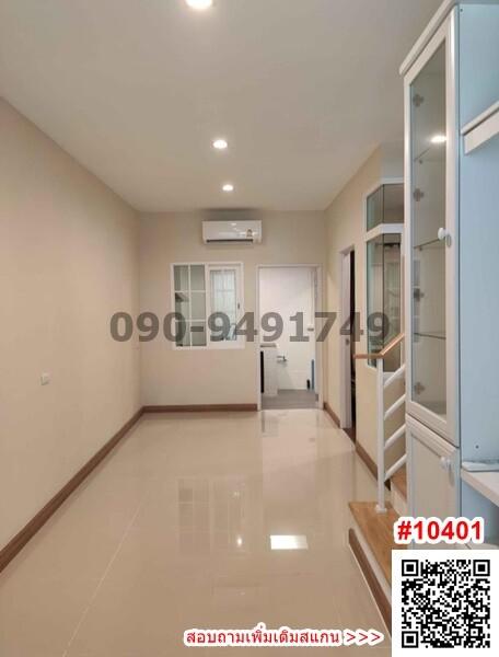 Modern and bright corridor with glossy tiled flooring and built-in glass door storage