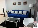 Cozy living room with a blue sofa and modern decor