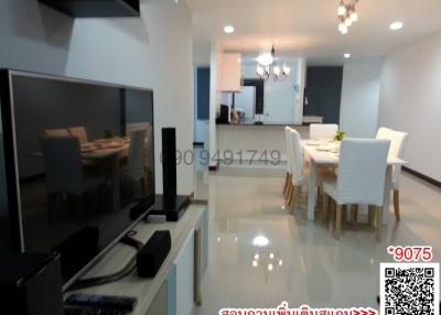 Modern living room and dining area with glossy floor tiles