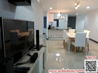 Modern living room and dining area with glossy floor tiles