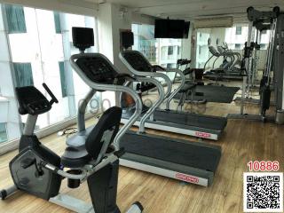 Modern gym facility with various exercise machines and equipment