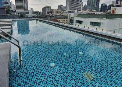 Rooftop swimming pool with city skyline view