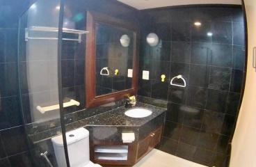 Modern bathroom with black tiling