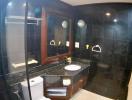 Modern bathroom with black tiling