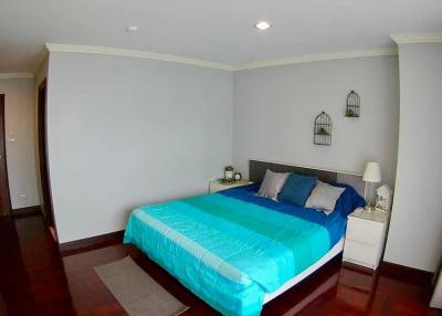 Cozy furnished bedroom with ample lighting