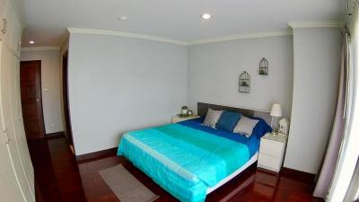 Cozy furnished bedroom with ample lighting