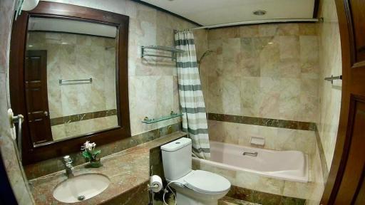 Spacious bathroom with elegant marble finishes and modern fixtures