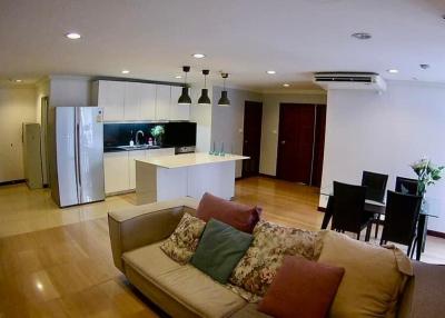 Spacious open concept living room with kitchen and dining area