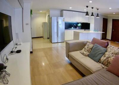 Spacious combined living room and kitchen with modern amenities