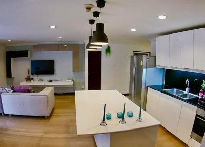Modern open space living room connected to kitchen with contemporary design and furnishings