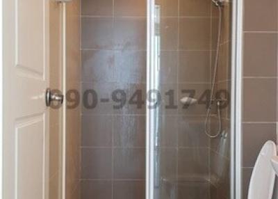 Modern bathroom with glass shower enclosure and toilet