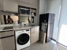 Modern kitchen with appliances and ample natural light