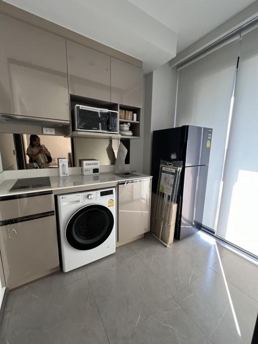 Modern kitchen with appliances and ample sunlight