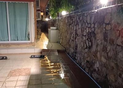 Illuminated walkway in the outdoor area of a property at night