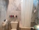 Modern bathroom with marble tiles and shower curtain